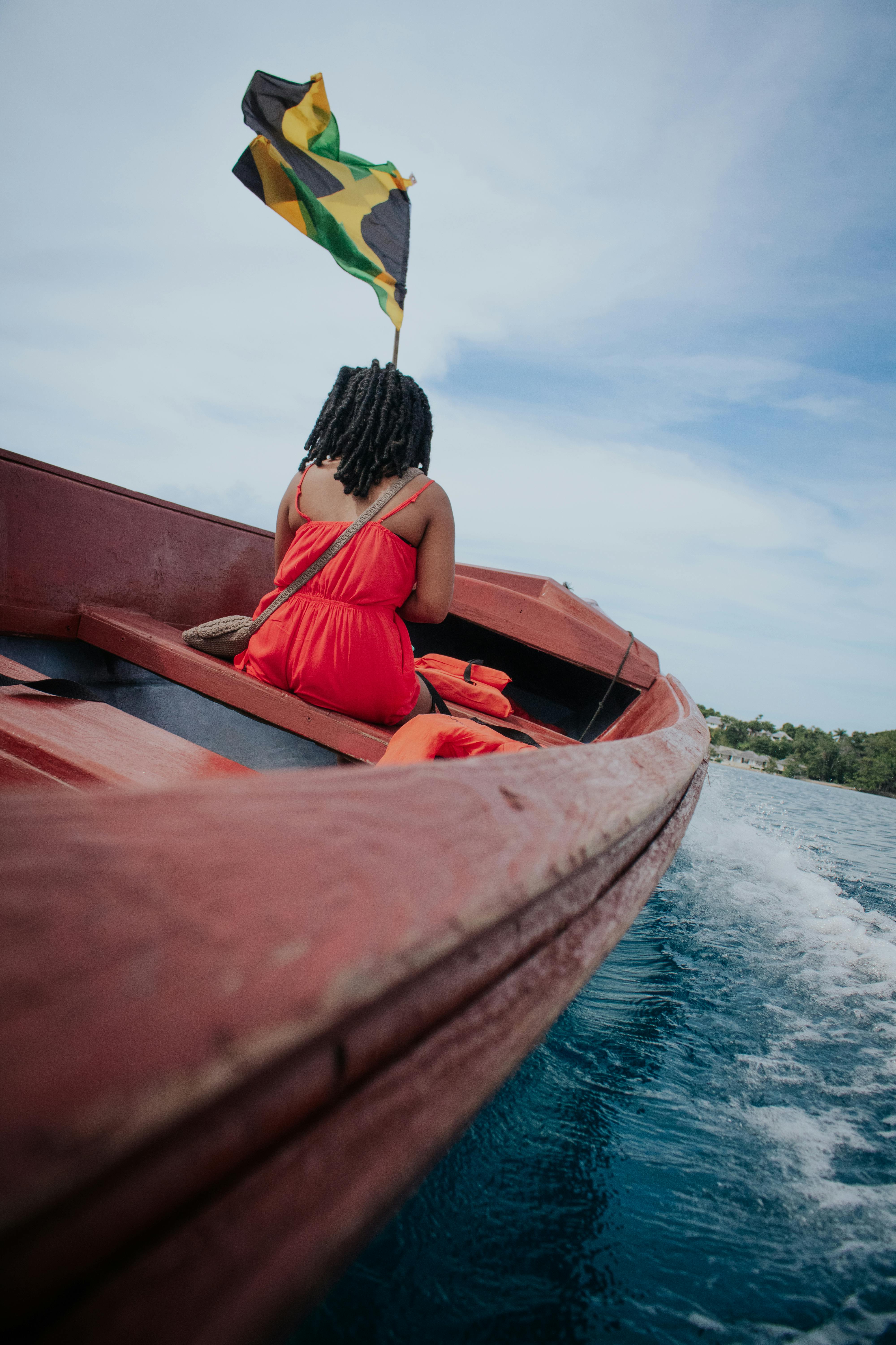 Traditional Jamaican boat ride through calm waters, showcasing local life