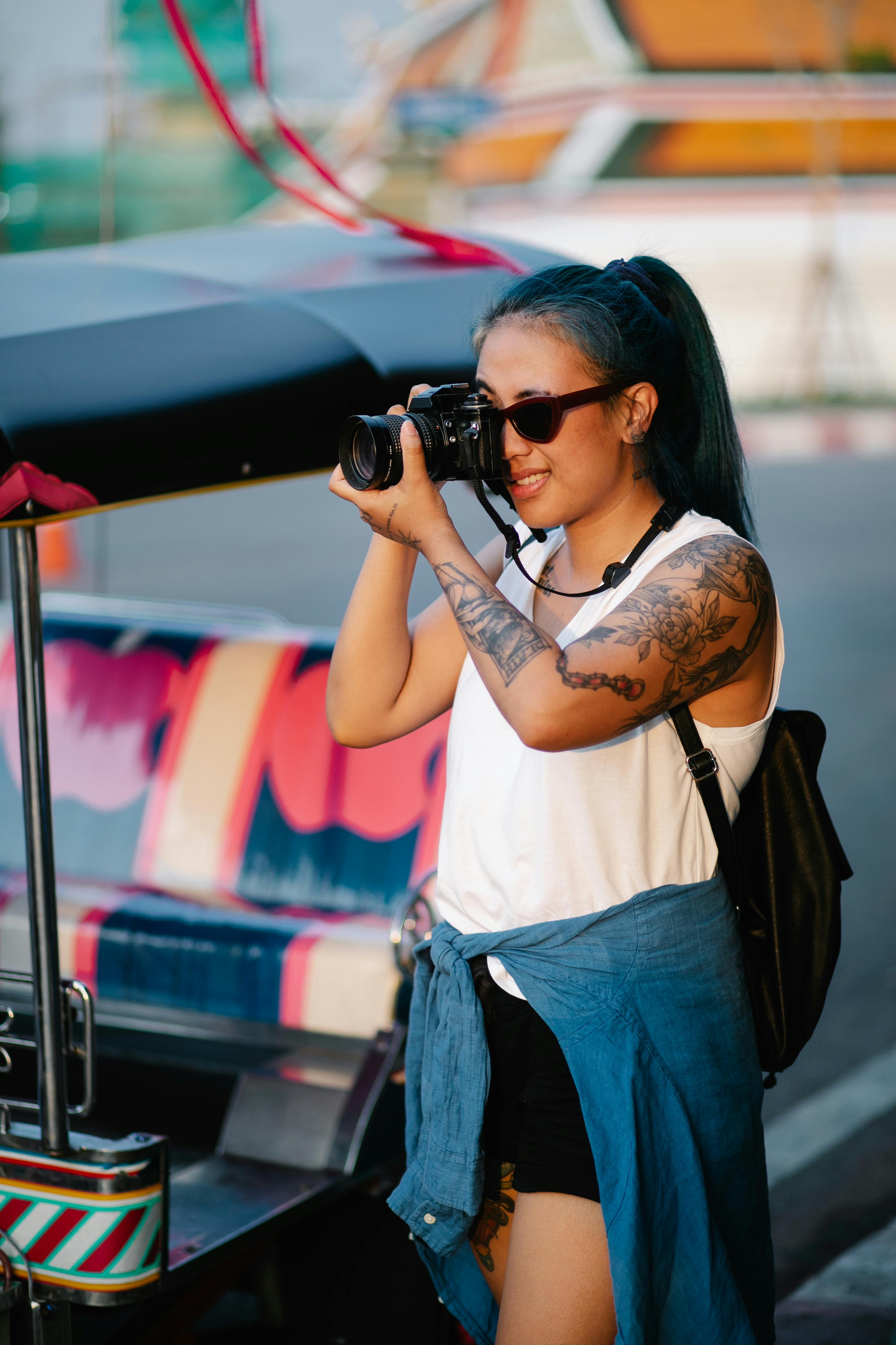 Woman capturing a coastal adventure in Jamaica with her camera