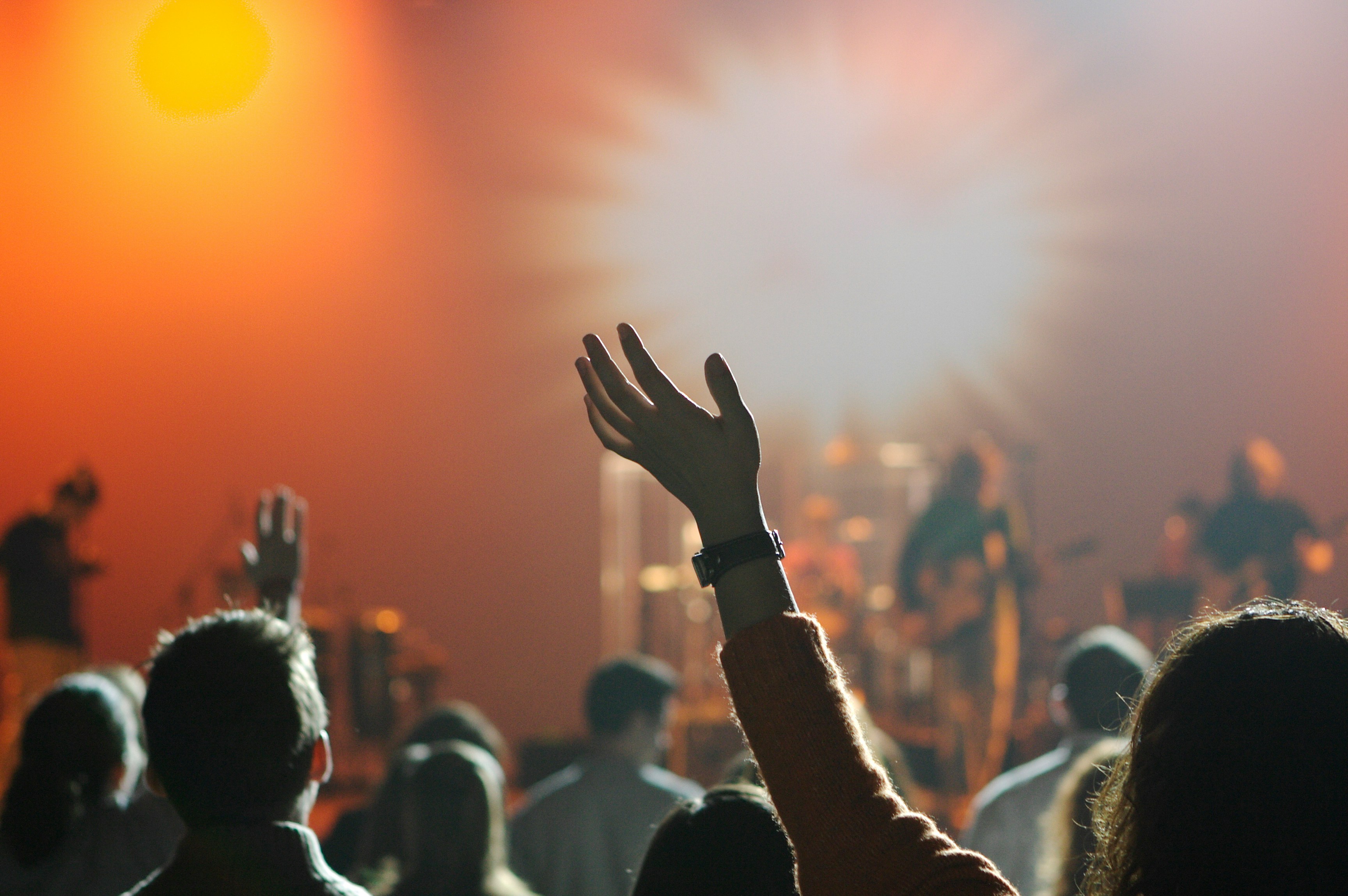 Group of people worshiping in faith